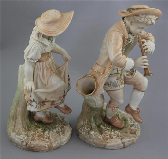 A pair of Royal Worcester blush ivory figures of Kate Greenway style children, modelled by James Hadley, 25.5cm and 24.5cm